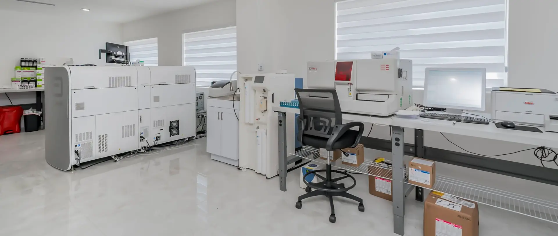 interior view of the Labpharma hematology laboratory with specialized equipment and workstations