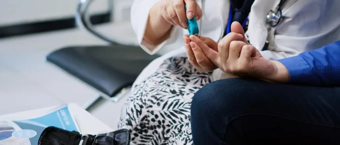 healthcare professional collecting a blood sample for preventive wellness testing